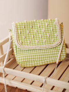 Are you a sling bag collector? Whether you are one or not, we bet you will become one after seeing this green sling bag as well as its simplicity and practicality. The checks' weaving, embellished beads and pearls make it a cutesy pick for a lunch date or a work meeting. Yep, it's THAT versatile. With one compartment and one pocket, this sling bag has been manufactured from printed jacquard fabric and lined with cotton on the inside. The metal fitting and the snap button add a polished look to t Trendy Green Woven Bag, Green Woven Crossbody Shoulder Bag, Green Woven Pouch Bag, Green Square Woven Bag, Green Woven Shoulder Bag, Green Woven Square Shoulder Bag, Green Sling Bag, Shoulder Sling Bag, Work Meeting