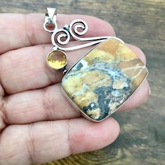 A Stunning Piece Of Yellow Jasper! Streaked And Mixed Throughout With Tan, Black, Gray And More! Cuteflourish Top Has A Sparkling Citrine (1/4”) Gemstone. The Jasper Stone Is Approx., 15/16”H X 1.1/4”L. The Entire Piece Is Approx., 2.1/8”H X 1.3/8”L. This Exceptional And Unique Piece Of Jewelry Is Handcrafted And Handmade By Artisans. 925 Sterling Overlay. Considered. ****16” Chain Included! Tags: Jewelry, Designer, Statement Piece, Ring, Earrings, Boho Chic, Watch, Country, Festival, Handcrafte Handmade Yellow Citrine Necklaces, Yellow Citrine Stone Jewelry, Yellow Citrine Jewelry With Stones, Handmade Yellow Citrine Jewelry, Unique Yellow Gemstone Necklaces, Unique Yellow Gemstone Necklace, Unique Yellow Gemstone Jewelry, Yellow Spiritual Gemstone Jewelry, Elegant Yellow Citrine Stone Jewelry