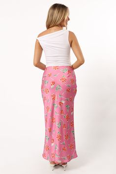 DETAILS   This midi length skirt is the perfect addition to your wardrobe. The slip style with invisible side zip ensures a comfortable fit, while the floral print detail gives it an extra touch of fun.    slip style skirt    midi length   invisible side zip  floral print design  soft satin feel   lined     material - 100% polyester     SIZING     model is 5' 5" and wears a Size XS    model stats: bust - 31.5", waist - 25.5", hips - 37"         GARMENT CARE    cold hand wash separately Floral Print Rayon Midi Skirt, Rayon Midi Skirt With Floral Print, Knee-length Bottoms With Side Slits For Summer, Fitted Asymmetrical Skirt With Floral Print, Spring Midi Bottoms With Side Slits, Spring Midi-length Bottoms With Side Slits, Summer Midi Bottoms With Side Slits, Fitted Floral Print Asymmetrical Skirt, Floral Print Pencil Skirt For Day Out