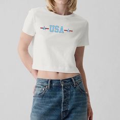 Looking for some fun graphic tees for spring and summer? We've got you covered with this adorable crop top - bringing your Y2K outfit dreams to life! Our stylish crop tops will become your new favorite from the first wear! Our stylish crop tops feature: 🤍 100% polyester for a soft, breathable feel. 🤍 Ribbed knit, crew neckline, and tear-away label. 🤍 Classic fit with a cropped style - PLEASE REFERENCE OUR SIZE CHART BEFORE PURCHASING. When shopping with Grace and Liv, please remember: ✨ Items Graphic Cotton Cropped T-shirt, Cropped Cotton T-shirt With Text Print, Graphic Cotton Crop Top T-shirt, Crew Neck Cotton Cropped Shirt With Logo Print, Cotton Crew Neck Cropped Shirt With Logo Print, White Cotton Crop Top With Text Print, Cotton Logo Print Crew Neck Crop Top, Cotton Graphic Print Crew Neck Crop Top, Crew Neck Cotton Crop Top With Logo Print