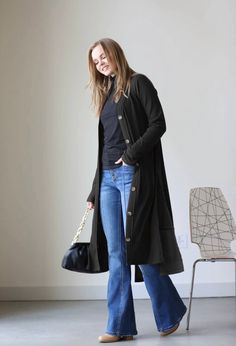 This long length cardigan features functional buttons and slits on both sides. It is super comfy, runs true to size and is a lighter weight material. Available in black only. Long Casual Sweater Coat For Layering, Casual Long Sweater Coat For Layering, Casual Long Sweater Coat For Everyday, Versatile Long Winter Cardigan, Versatile Winter Cardigan With Buttons, Long Sleeve Sweater Coat With Button Closure For Layering, Versatile Button-up Cardigan For Layering, Fall Button-up Cardigan For Loungewear, Casual Long Outerwear For Everyday