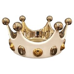 a gold and white crown is shown on a white background