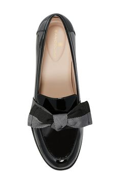 A sophisticated bow details the vamp of a slip-on loafer for a casual chic attire. Sizing: True to size. M=standard width. 1" heel Round apron toe Bow detail Slip-on Synthetic upper, manmade sole Imported Elegant Patent Leather Platform Loafers For Party, Spring Formal Flats With Bow, Elegant Spring Platform Loafers For Office, Classic Formal Heels With Bow, Elegant Fall Platform Loafers In Patent Leather, Black Low Heel Platform Loafers For Formal Occasions, Elegant Patent Leather Platform Loafers For Spring, Elegant Patent Leather Platform Loafers For Fall, Elegant Platform Loafers For Party