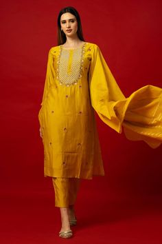 Elevate your wardrobe with the Yellow Silk Kurti Set. This set stands out with its intricate embroidery work. It transcends seasonal trends, offering versatility for various occasions. Whether it's a family gathering, festive celebration, or formal event, the Yellow Silk Kurti Set ensures you stand out with elegance. Its timeless appeal guarantees it as a cherished piece in your collection for years to come. Yellow Silk Kurti, Baluchari Saree, Golden Blouse, Golden Saree, Silver Blouse, Orange Saree, Net Blouses, Silk Kurti, Cotton Gowns