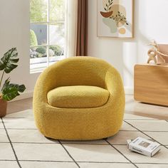 a yellow chair sitting on top of a white rug next to a potted plant