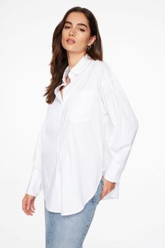 For a look so classic, so cool. Features - Long sleeves, buttoned cuffs - Shirt collar - Button-up - Front chest pocket - Pleated detail at back Size & Fit - Oversized fit, non-stretch - Model is wearing size S Materials & Care - 97% Cotton, 3% Spandex - Machine wash - Imported Cuffs Shirt, Oversized Poplin Shirt, So Cool, Shirt Collar, Shirt White, Chest Pocket, Timeless Fashion, Shirt Blouses