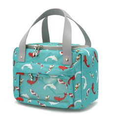 a blue lunch bag with red and white dolphins on the front, gray handles and grey straps