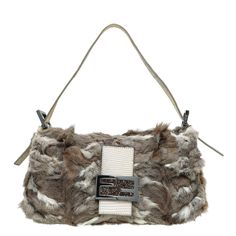 Price Excluding VAT Material: Brown Rabbit Fur with Leather Trim and Crystal FF Buckle Hardware: Gunmetal Features: Pockets: Interior Zipper Pocket Bag style: Shoulder Bag Closure type: Flap with Magnetic Closure Serial Number / Stamp / Date Code: 2308 - 8BR000 - 029 Measurement in inches: W x D x H Inclusions: Wrong Dust Bag Condition: in very good condition – 7 out of 10 Exterior: very good condition, with few scratches on the hardware, leather and showing normal signs of use. Interior: very good condition, and showing normal signs of use Brown Rabbit, Burberry Glasses, Cartier Sunglasses, Jimmy Choo Sunglasses, Fendi Shoes, Baguette Bag, Handbag Wallet, Bag Style, Bags Designer Fashion