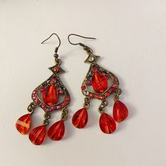 Red Earrings New Use Never Worn Before If Interested Red Crystal Metal Earrings For Parties, Red Crystal Metal Party Earrings, Red Metal Crystal Party Earrings, Red Metal Chandelier Earrings For Party, Red Vintage Dangle Chandelier Earrings, Red Metal Earrings For Party, Vintage Red Dangle Chandelier Earrings, Festive Red Dangle Crystal Earrings, Red Teardrop Crystal Earrings