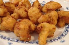 some fried food on a blue and white plate