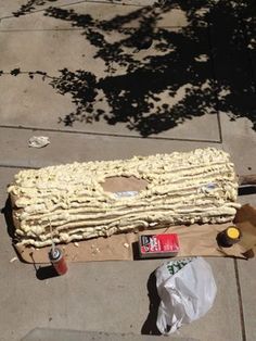 a hot dog bun sitting on top of a cardboard box