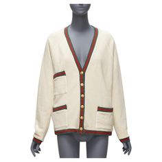 GUCCI Reversible green red web gold GG button oversized cardigan S Reference: TGAS/D00534 Brand: Gucci Designer: Alessandro Michele Material: Cotton, Viscose Color: Cream, Multicolour Pattern: Monogram Closure: Button Lining: Cream Fabric Extra Details: Reversible with one side with signature green red web trims. The other side is with GG floral discreet jacquard with green trimmings. Made in: Italy CONDITION: Condition: Excellent, this item was pre-owned and is in excellent condition. Comes wit Gucci Jumper, Gucci Cardigan, Green Web, Polka Dot Cardigan, Red Web, Belted Sweater, Gucci Brand, Jersey Vintage, Mario Testino