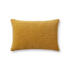 a yellow pillow on a white background