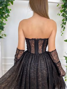 Details: -Designer black lace fabric and a sparkling finish look -Sweetheart strapless neckline -Fully boned corset -Cinched waist -Midi-length gathered skirt -Inseam pockets -Optional opera gloves