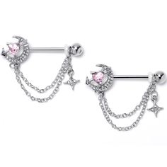 two piercings with stars, moon and heart shaped pink crystal stones on chain attached to them