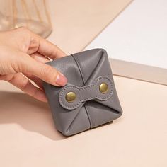 Description: Crafted with high-quality cowhide, this mini wallet offers a compact solution to keep your belongings well-organized. Whether you need a coin wallet, key pouch, or a case for your earphones, this small leather pouch is designed to meet your daily needs effortlessly.  Size: - Height: 3.27 inches (8.3 cm) - Width: 1.30 inches (3.3 cm) - Length: 2.87 inches (7.3 cm) - Weight: 0.088 lb   Delivery Time: - USA: 7-10 days - Europe: 7-12 days - Canada: 10-15 days - Asia: 15-25 days  Give the gift of functionality and style with this Personalized Small Leather Pouch. Perfect for any occasion, this mini genuine coin wallet, key pouch, and earphone case will impress with its practicality and personalized touch. Order yours today and enjoy the convenience and elegance this accessory offer Gray Bags With Card Slots For Daily Use, Gray Bags With Card Slots For Everyday Use, Gray Travel Bags With Card Slots, Everyday Gray Bag With Card Slots, Portable Leather Coin Purse For Everyday Use, Versatile Wallet With Interior Key Chain Holder As Gift, Versatile Rectangular Coin Purse For Gifts, Versatile Rectangular Coin Purse As Gift, Portable Leather Coin Purse As Gift