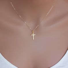 A Simple Real Gold Cross dangle from a delicate chain . Dainty thicker cross necklace made of solid 14KT Yellow Gold on a delicate cable chain or box chain or rope chain with spring clasp. This 14-karat yellow gold cross charm features a simple, classic design and bright finish. Model is wearing an 16" length. Necklace length can be different, depends on your high and weight.  Ideal For: Daily wear to keep your faith close Special religious occasions like First Communions or Confirmations A mean Yellow Gold Cross Necklace, Cross Necklace Simple, Necklaces Ideas, South San Francisco, Gold Cross Necklace, Gold Cross Pendant, Cross Jewelry, Gold Cross, Cross Charms