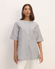 The Supima® Cotton Tunic Optic White / Black – Everlane Chic Cotton Tunic With Short Sleeves, Chic Short Sleeve Cotton Tunic, Oversized Short Sleeve Everyday Blouse, Spring Workwear Tunic With Shirttail Hem, Summer Cotton Tunic With Short Sleeves, Summer Workwear Tunic In Relaxed Fit, Chic Tunic With Shirttail Hem For Daywear, Spring Short Sleeve Top With Rolled Sleeves, Relaxed Fit Summer Tunic For Workwear