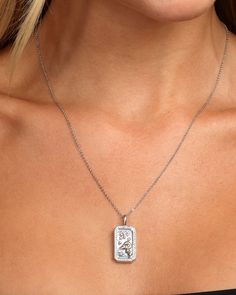 Know your strengths, never forget who you are. Our exclusive Zodiac Amulets are carefully hand-carved with Mother of Pearl inlay set in a pavé frame with colorful gems unique to each sign. These double-sided pendants also include personalized fierce features engraved on the back to remind you of your own unique traits. Unleash the power of your YOUniverse… and look HOT doing it. DETAILS: Pendant Necklace Adjustable Length: 18" to 21" Pendant Size: .90" x .50" Lobster Clasp SKU: N6020 MATERIALS: Tarnish Resistant Silver Rectangular Pendant Jewelry, Silver Tarnish Resistant Rectangular Pendant Jewelry, Silver Tarnish-resistant Rectangular Pendant Jewelry, Silver Jewelry With Rectangular Coin Pendant, Melinda Maria Jewelry, Pisces And Taurus, Aries And Pisces, Gemini And Leo, Mother Of Pearl Inlay