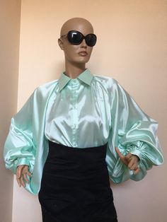 "This is a very stylish Womens Silk blouse. It is comfortable and cozy. Made for a free flowing fit. Great for all year around and for any special occasion or casual day can be dressed up or dressed down. SIZE CHART SIZE S - US 6, UK 8, EU 36 bust: bust around 34.5\"/90cm Waist: waist around 27.5\"/70cm Hips: hips around 34.5\"/90cm SIZE M - US 8, UK 10, EU 38 bust: bust around 37.5\"/95cm Waist: waist around 29.5\"/75cm Hips: hips around 37.5\"/95cm SIZE L - US 10, UK 12, EU 40 bust: bust aroun Voluminous Blouse With Blouson Lantern Sleeves, Voluminous Blouse With Gathered Balloon Sleeves, Chic Voluminous Long Sleeve Blouse, Chic Blouse With Voluminous Bishop Sleeves, Elegant Billowy Puff Sleeve Top With Long Sleeves, Chic Voluminous Blouse With Lantern Sleeves, Elegant Billowy Long Sleeve Puff Sleeve Top, Elegant Billowy Long Sleeve Puff Top, Chic Blouson Sleeve Voluminous Blouse