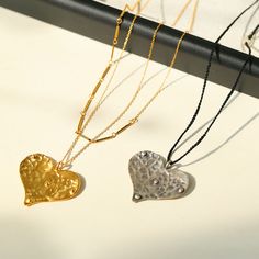 Embrace the spirit of love with our charming large love knot and long chain necklaces. These beautiful pieces combine the timeless elegance of a knot with the symbolic charm of a heart pendant, creating a beautiful accessory that celebrates the power of love.Main features:Our necklace comes in two charming styles, with a black knot and gold chain, and is decorated with a heart-shaped pendant on the gold and silver chain, symbolizing love. The pendant adds a touch of romance and charm to the neck Gold Necklace With Large Heart Pendant, Elegant Large Pendant Necklace For Valentine's Day, Elegant Valentine's Day Necklace With Large Pendant, Elegant Hammered Pendant Charm Necklace, Elegant Handmade Heart Pendant Charm Necklace, Elegant Handmade Double Heart Necklace, Elegant Long Necklace With Heart Charm, Rope Knots, Power Of Love