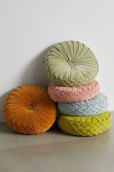 four round cushions stacked on top of each other