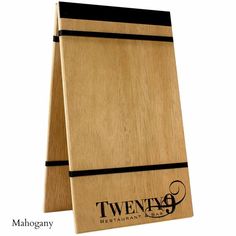 a wooden cutting board with two black lines on the front and back of it that says twenty9 restaurant co