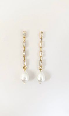 Our pearl drop bridal earrings are simply stunning! A simple classic earring. Little bit of bling, classic pearl, small drop... perfect combo! These long pearl drop earrings catch the light, packing serious sparkle for their size. Combining marquise crystals stones they're finished with glowing pearls. With just the right amount of sparkle, this dainty pair is perfect for brides, mother of the bride and bridesmaids alike. -Drop Pearls are light ivory- These Crystal and pearl wedding earrings wil Bridal Jewelry Pearl Earrings, Bridal Jewelry Pearl, Brides Mother, Jewelry Pearl Earrings, Gold Bridal Jewelry, Long Crystal Earrings, Earrings For Bride, Pearl Drop Earrings Bridal, Bridal Statement Earrings