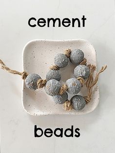 cement beads on a white plate with the words cement beads in black and white letters