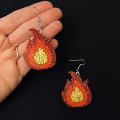 Brand New These Are So Fun! Sparkly, Acrylic Flame Dangle Earrings. There Is A Protective Film For You To Peel Off After Purchase. Please See Photos For Measurements And Details. Check Out My Closet For More Camping Themed Items! All Listings Are Packaged With Care- See Reviews Resonable Offers Welcome Smoke Free Home Same Or Next Day Shipping Flame Earrings, Earrings Color, Black Orange, Orange Black, Dangle Earrings, Jewelry Earrings, Women Jewelry, Camping, Orange