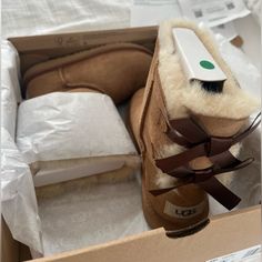 New In Box Ugg Bailey Bow Ii Boots In Chestnut Brown With Brown Silky Ribbon Bows On Back. Us Kids Size 1. Never Worn, Still Have Original Receipt. Beautiful Beige Interior. Still Wrapped In Tissue Paper. Smoke-Free, Pet-Free Home. Cute Brown Shoes, Brown Uggs, Cute Uggs, Uggs With Bows, Ugg Bailey Bow, Ugg Kids, Bailey Bow Uggs, Ugg Bailey, Shoe Ideas