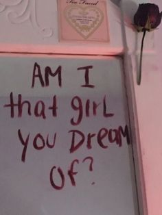 a sign that says, am i that girl you dream off?