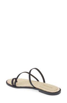 A woven raffia footbed and slender toe loop emphasize the beachy vibe of an easy-wear slide sandal made for sunny days. Synthetic upper/leather lining/synthetic sole Imported Hispanic & Latinx Owned/Founded Synthetic Footbed Sandals With Single Toe Strap For Vacation, Synthetic Single Toe Strap Vacation Footbed Sandals, Synthetic Single Toe Strap Footbed Sandals For Vacation, Beach Footbed Sandals With Toe Post, Synthetic Toe Post Footbed Sandals For Beach, Spring Beach Footbed Sandals With Single Toe Strap, Natural Straw Sandals With Textured Footbed, Summer Style Flip Flops With Single Toe Strap, Adjustable Toe Post Footbed Sandals For Beach