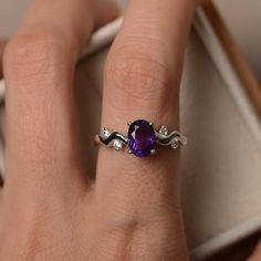 This ring features a 6mm*8mm oval cut amethyst and sterling silver finished with rhodium. Customization is available. It is made by hand, and it will take about 7 days to finish the ring after your payment is completed. Main stone: natural amethyst Amethyst weight: Approx 98 ct Metal type: sterling silver finished with rhodium Accent stone: cz Customization is available, I also can make it with 14k solid gold (white or yellow or rose) and diamond accent stone, just feel free to contact me. Any q Ring For Wedding, Purple Amethyst Ring, Purple Band, February Birthstone, Ring Photos, February Birth Stone, Anniversary Ring, Amethyst Ring, Birthstone Ring