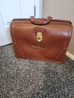 IF YOU ARE INTERESTED IN A LOWER SHIPPING RATE PLEASE OPT FOR ADVANTAGE GROUND WHICH USUALLY TAKES ABOUT 2 DAYS LONGER THAN PRIORITY. IF IT DOESN'T SHOW UP AT CHECKOUT PLEASE CONTACT ME. Mid Century Split Cowhide Leather Top Open Halliburton Briefcase Good Vintage Condition. External Scrapes. Bottom Corner Of One Side In Rough Shape. Interior Good Condition And Fairly Clean. Interior PieceOf Leather Has Come Unglued . See Photos Previous Owner's Name Stamped On Front. Hallibuton And Six Years Driving , No Chargeable Accident  Reddish Brown With White Top Stitching Gold Brass Latch Leather Handle Weight 4 Lbs 8 Oz 12" High 16" Wide 6" Deep Retro Rectangular Leather Briefcase, Vintage Brown Business Bags, Vintage Brown Bags For Business, Vintage Rectangular Business Case, Vintage Brown Rectangular Case Bag, Vintage Rectangular Briefcase For Formal Occasions, Vintage Brown Bag With Luggage Sleeve, Vintage Rectangular Briefcase For Formal Use, Vintage Business Cases With Leather Lining