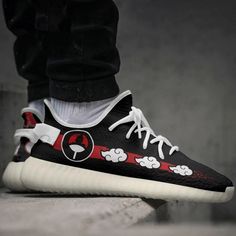 Step into the world of Naruto with our Itachi Akatsuki Cloud Shoes. Inspired by the iconic Yeezy sneaker design, these shoes are a must-have for any Naruto anime fan. Made with high-quality materials, these sneakers offer both style and comfort. Featuring the Akatsuki cloud pattern on the sides, these shoes pay homage to the legendary Itachi Uchiha. The vibrant red color symbolizes power and passion, making a bold statement wherever you go. The breathable mesh upper ensures your feet stay cool a Casual Custom Sneakers With Anime Print For Sports, Black Anime Style Sneakers For Streetwear, Black Custom Sneakers With Anime Print For Streetwear, Black Casual Custom Sneakers With Anime Print, Casual Low-top Custom Sneakers With Anime Print, Black Sneakers With Anime Print For Sports, Black Custom Sneakers With Anime Print, Black Custom Sneakers With Anime Print And Round Toe, Black High-top Sneakers With Anime Print