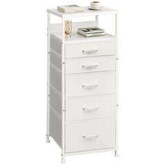 a white filing cabinet with five drawers and a coffee cup on top in front of it