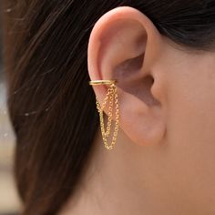 ✈️ Free DHL Express shipping to USA, EU countries & Canada - delivery in just 2 days! This totally handmade 925 sterling silver huggie ear cuff with chain requires no piercing. Available in plain silver. rose gold or yellow gold plated over sterling silver body. Price is for a single piece. Select to buy a pair in a better price from the drop down list. Base metal is 925 solid sterling silver, plated with: - Rhodium (plain silver finish) or - 18K rose gold (rose gold finish) or - 24K gold (y Adjustable Gold Ear Cuff With Chain, Adjustable Gold Plated Single Ear Cuff, Adjustable Single Gold Plated Ear Cuff, Pierced Silver Ear Cuff Gold Plated, Yellow Gold Dangle Ear Cuff For Pierced Ears, Yellow Gold Dangle Ear Cuff, Silver Gold-plated Single Ear Cuff, Pierced Dangle Ear Cuff For Everyday, Everyday Pierced Dangle Ear Cuff