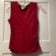 Sleeveless Red Tank Top With Sparkle Accents. Never Worn Red Stretch Tank Top For Party, Stretch Red Tank Top For Party, Red Stretch Sleeveless Tank Top, Red Sleeveless Blouse For Party, Red Sleeveless Tank Top For Night Out, Elegant Red Tank Top For Night Out, Elegant Red Sleeveless Top, Elegant Red V-neck Tank Top, Sleeveless Tops For Spring Holiday