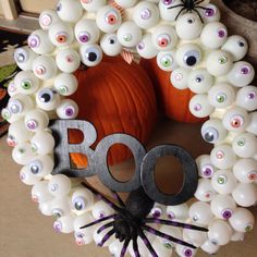 a halloween wreath made out of balloons and googly eyes