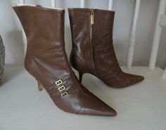 Vintage 1980's Designer Boots by Adrienne Vittadini, Size 9 ( due to the Keen pointed toe style of these boots they fit more like size 8.5 ).  These boots are pre-owned, minimally worn, almost new condition. They are made of real Italian Leather including upper and sole of boot. These Vintage boots are a rare Find. Gold Tone Hardware includes Side Zipper and Buckles. 3 inch comfortable heel height,  7 inch ankle shaft height, boots are very clean with a few scuff marks on heel area of Right boot ( see photo # 9) . Great Vintage shoe wear that can be worn with Jeans, Pants, Skirts and Dresses. Overall boots are in exceptional 1980's period condition. Womens Booties, Vintage Shoe, Booties Ankle Boots, Pointed Toe Boots, Adrienne Vittadini, Vintage Boots, Comfortable Heels, Vintage Belts, Designer Boots