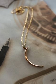 Crescent necklace on an 18" gold filled chain. Item is final sale. Minimalist Gold Chain Necklace As Gift, Minimalist Gold Chain Necklace Gift, Minimalist Gold Chain Necklace For Gift, Long Gold Chain Necklace For Gift, Elegant 14k Gold Filled Crescent Jewelry, Elegant Crescent 14k Gold Filled Jewelry, 14k Gold Long Necklace For Gift, Elegant Crescent-shaped 14k Gold Filled Jewelry, Elegant Everyday Gold Custom Necklace