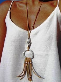 Product Details Product Title: Beach Ethnic Versatile Leather Rope Long Necklace QAR90 Decoration/Process: Metal,Tassel Main Material: Metal,PU Activity: Daily,Vacation Pattern: Geometric Style: Boho Theme: All Season Type: Pendant Necklaces Color: As Picture Size: One-size Chic Long Tassel Necklaces, Chic Silver Jewelry With Tassels, Silver Necklace Summer Fashion Accessory, Silver Necklace For Summer Fashion, Chic Silver Jewelry For Beach, Chic Silver Jewelry For The Beach, Chic Silver Beach Jewelry, Handmade Lariat Tassel Necklace, Chic Summer Jewelry With Tassels