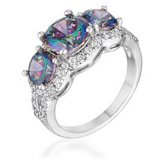 three stone ring with white topaz and multicolored stones on the sides, set in