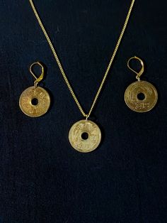 "Japanese 5-yen coins are polished bright and offered as a pendant & earring set.   The Japanese for \"five yen,\" go en (五円) is a homophone with go-en (御縁), \"en\" being a word for causal connection or relationship, and \"go\" being a respectful prefix. As a result, five-yen coins are commonly given as donations at Shinto shrines with the intention of establishing a good connection with the deity of the shrine. Several different interpretations of this \"luck\" exist depending on how many five Coin Pendant Medallion Earrings For Gift, Round Coin Pendant Earrings For Gifts, Round Coin Pendant Earrings As Gift, Traditional Coin Shaped Good Luck Jewelry, Traditional Round Disc Jewelry As Gift, Japanese Jewellery, Pendant Earring Set, Green Tiger Eye, Japanese New Year