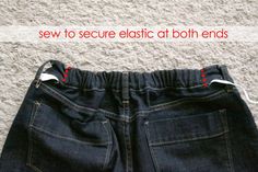 an image of someones jeans with the words sew to secure elastic at both ends