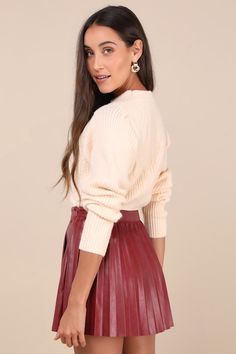 The Lulus Chic Edge Burgundy Vegan Leather Pleated High-Rise Mini Skirt calls in admirers all day long! Smooth vegan leather shapes this stylish skirt with a high, banded waist and an A-line silhouette with a classic pleated design. Perfect mini hem completes the look. Hidden side zipper/clasp. Pair to perfection with your favorite knee-high boots! Fit: This garment fits true to size. Length: Mid-thigh. Size medium measures 15.50" from waist to hem. Waist: Fitted - very fitted at natural waist. Maroon Skirt Outfit, Pleated Skirt Outfit Work, Red Leather Skirt Outfit, Pleated Leather Skirt Outfit, Burgundy Skirt Outfit, Winter Midi Skirt Outfit, Anna Herrin, Red Leather Skirt, Maroon Skirt