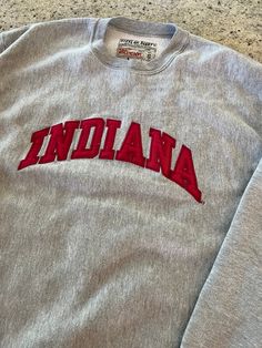 Vintage Indiana University Reverse Weave Crewneck Sweatshirt  Size Small  See pics for measurements  Quality Brand Steve & Barrys  Quality Embroidered Letters  Nice piece of vintage IU gear.   Excellent condition  Excellent Quality  Quick shipping. We ship same or next day with USPS mail  We are a small family business and we appreciate your purchase, Godspeed ! Indiana University Sweatshirt, Vintage Cotton Sweatshirt For Game Day, Vintage Crew Neck Sweatshirt With Embroidered Logo, Collegiate Streetwear Top With Embroidered Text, Vintage Long Sleeve Sweatshirt With Letter Embroidery, Collegiate Style Tops With Embroidered Text For Streetwear, Throwback College Tops With Embroidered Logo, Vintage Long Sleeve Tops With Embroidered Text, Vintage Crew Sweatshirt With Embroidery