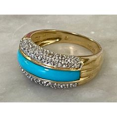 14 karat yellow gold ring, inlaid with a strip of Persian turquoise surrounded by .25 carats of shimmering pavé diamonds. Size 6.5. Marked with maker's mark and stamped 14 KT/585. Fine Gold Turquoise Ring With Diamond Accents, Gold Diamond Turquoise Ring For Anniversary, Gold Diamond Turquoise Ring, Turquoise Ring With Diamond Accents For Anniversary, Gold Turquoise Diamond Ring, Persian Turquoise, Maker's Mark, Yellow Gold Ring, Yellow Gold Rings