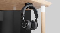 the headphones are attached to the wooden shelf